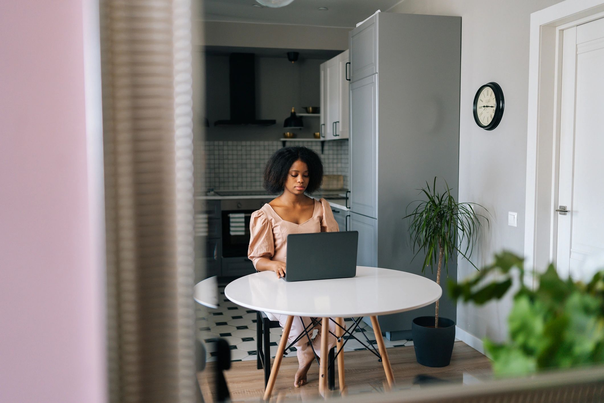 Woman in a home office preparing for an online consultation